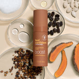Feel Confident Thickening Foam bottle surrounded by coffee beans, pumpkin seed oil, saw palmetto and turmeric ingredients