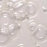 Close-up of Feel Confident Thickening Scalp Serum texture — lightweight leave-in formula for stronger hair